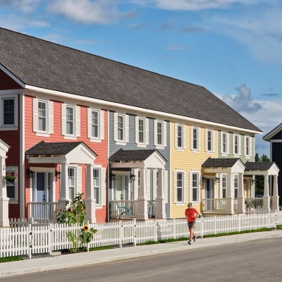Running by colourful townhouses